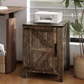 Simple wooden bedside table equipped with sliding barn door adjustable shelves and double storage space suitable for bedrooms and living room
